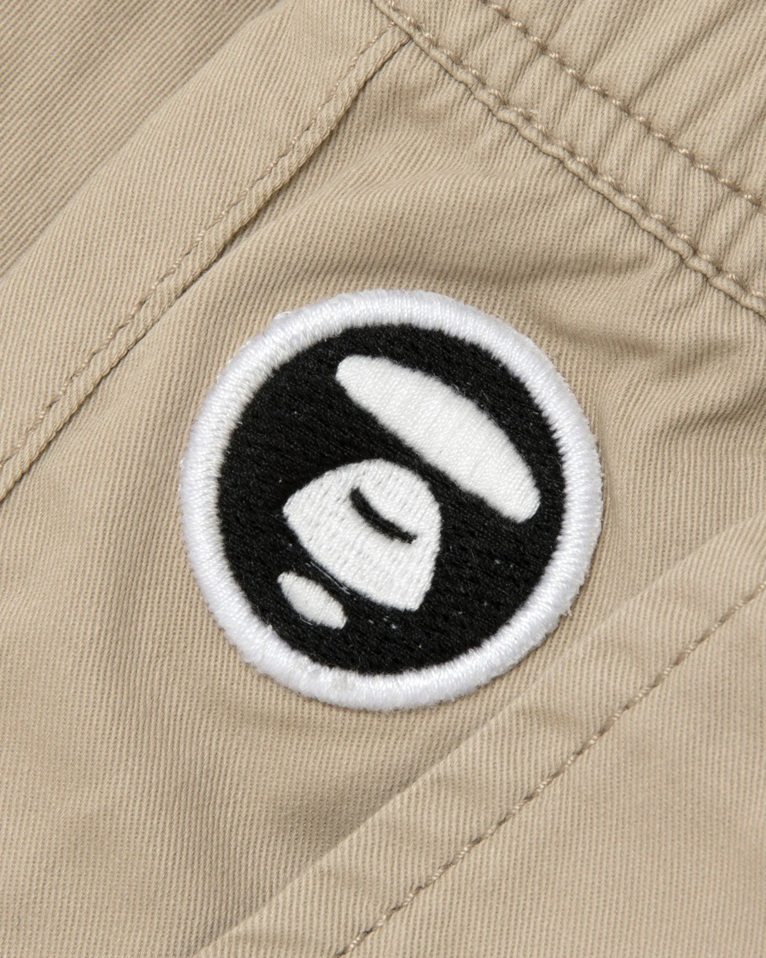 Moonface embroidered relaxed pants