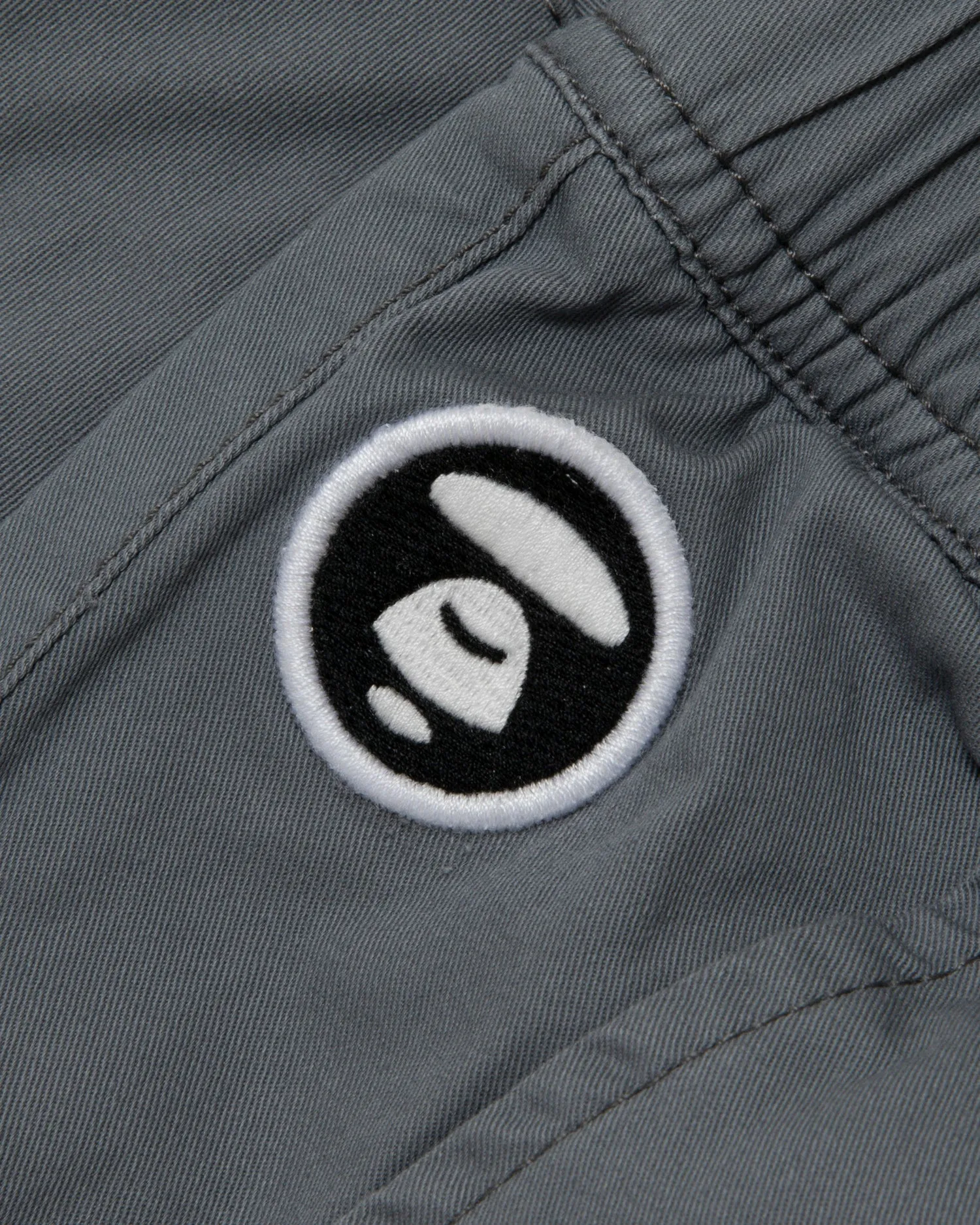 Moonface embroidered relaxed pants