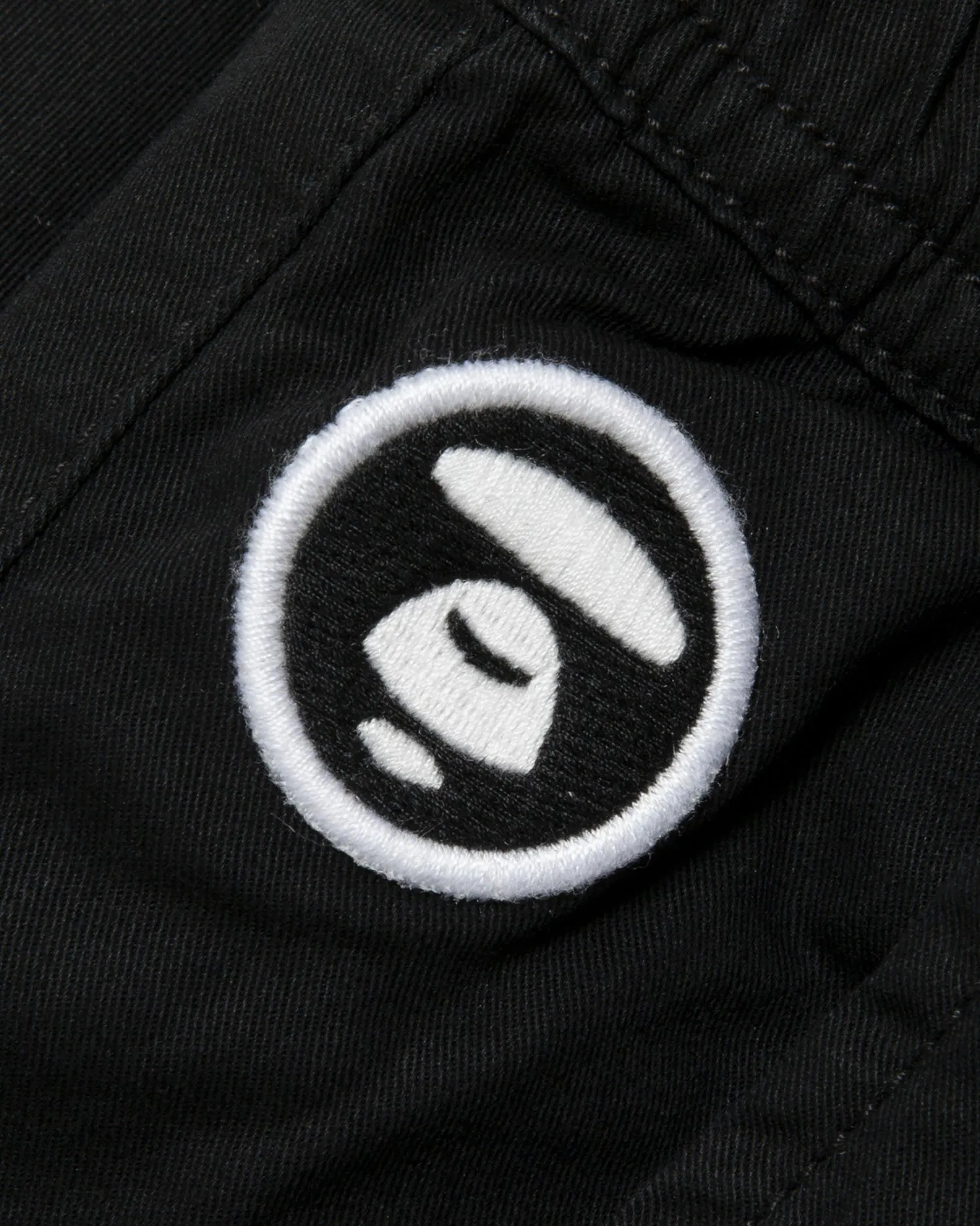 Moonface embroidered relaxed pants