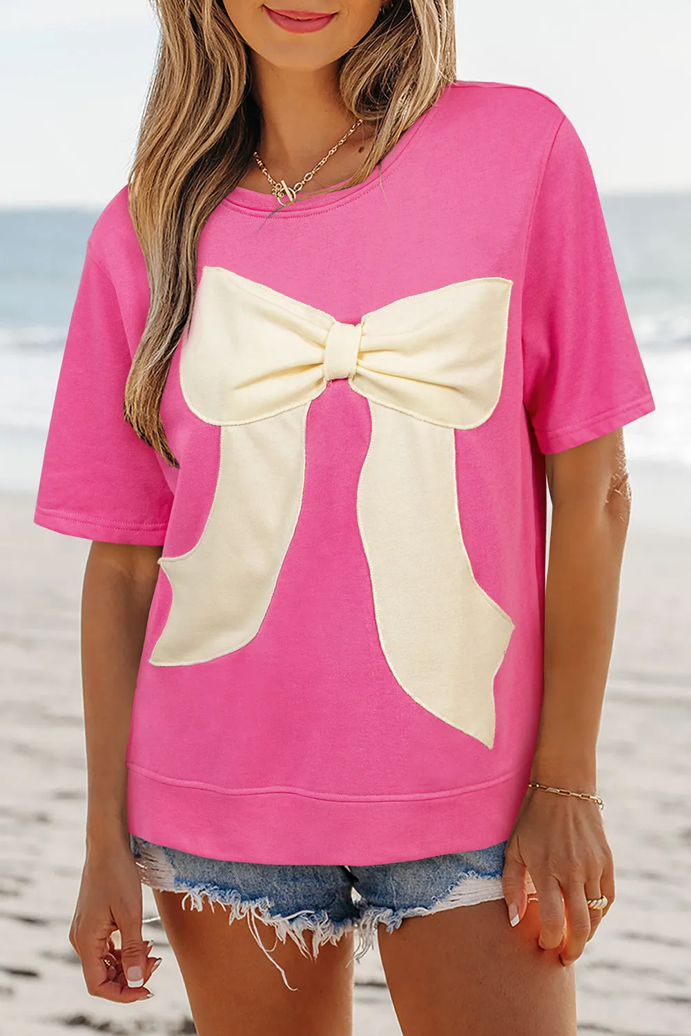 Strawberry Pink Contrasting Color Ribbon Bow Front Patch Loose Tee with Slits