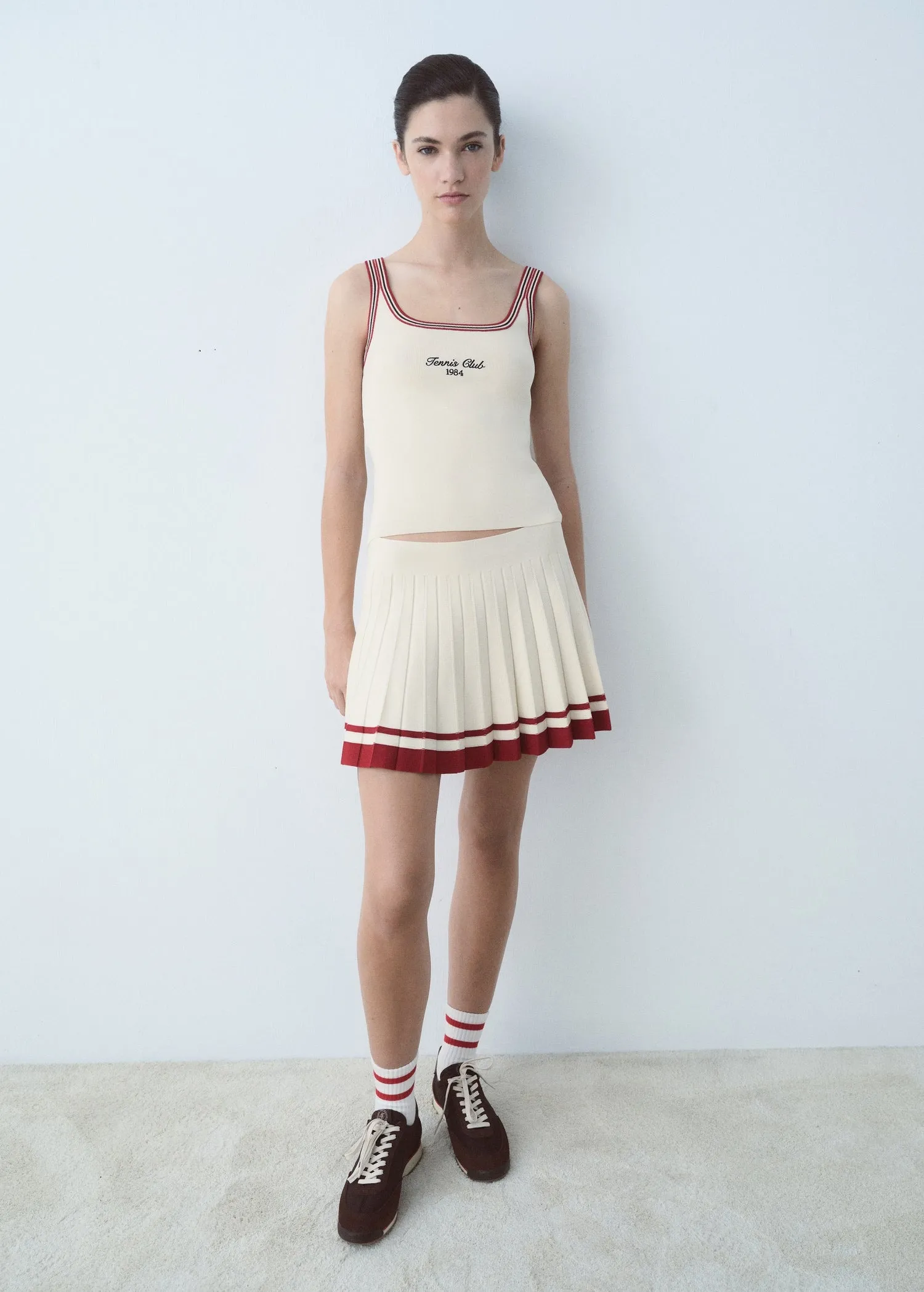Top embroidered message contrast trim